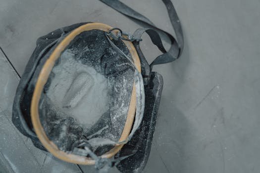 Chalk bag filled with climbing chalk bag, showcasing gear essentials for climbers in a detailed close-up view.